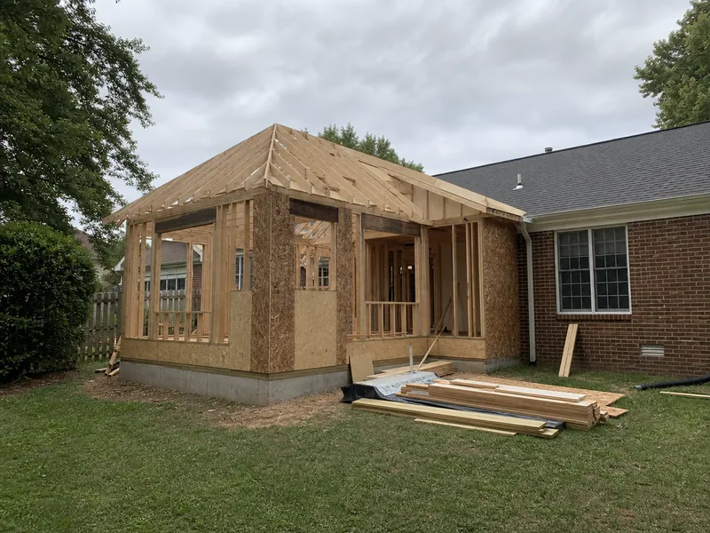Timber-framed home addition under construction